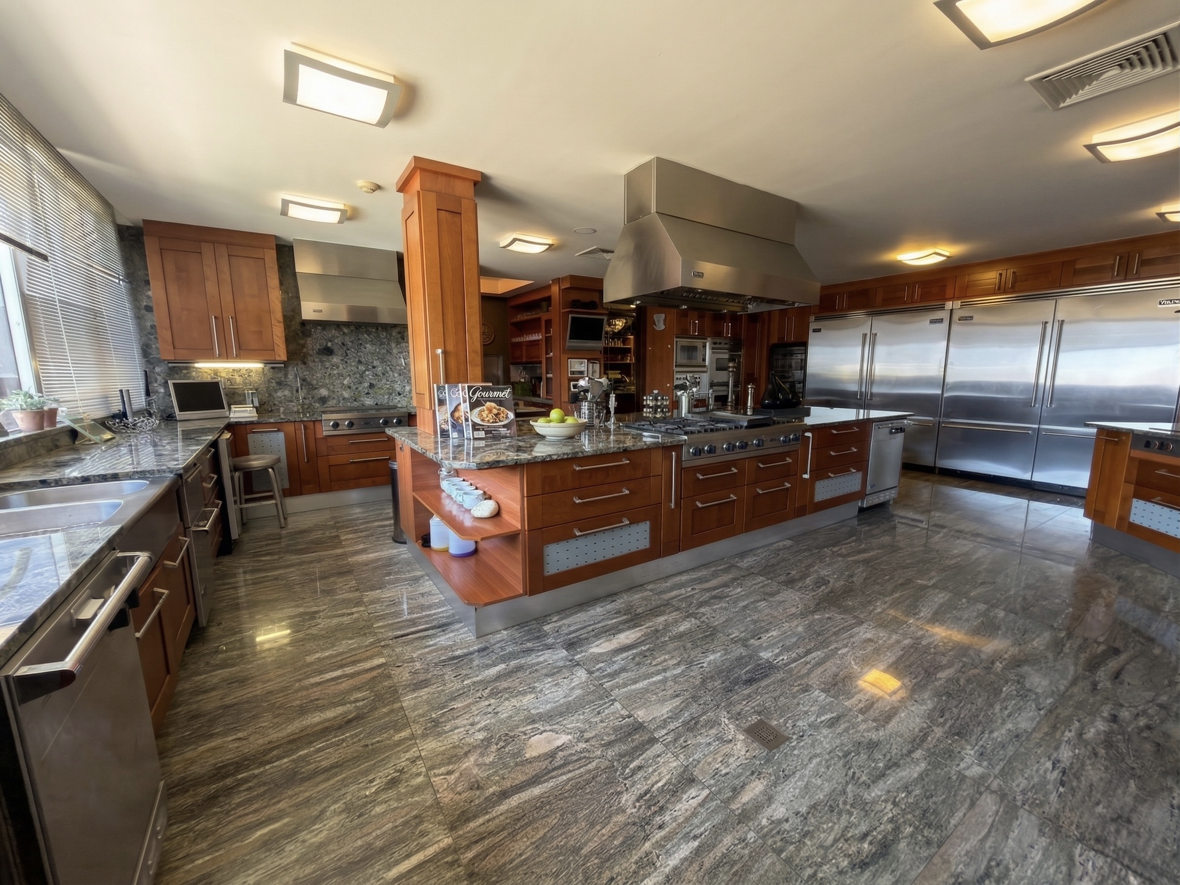 Professional gourmet kitchen with Viking appliances, cherry wood cabinets and granite island, luxury estate Caracas Venezuela